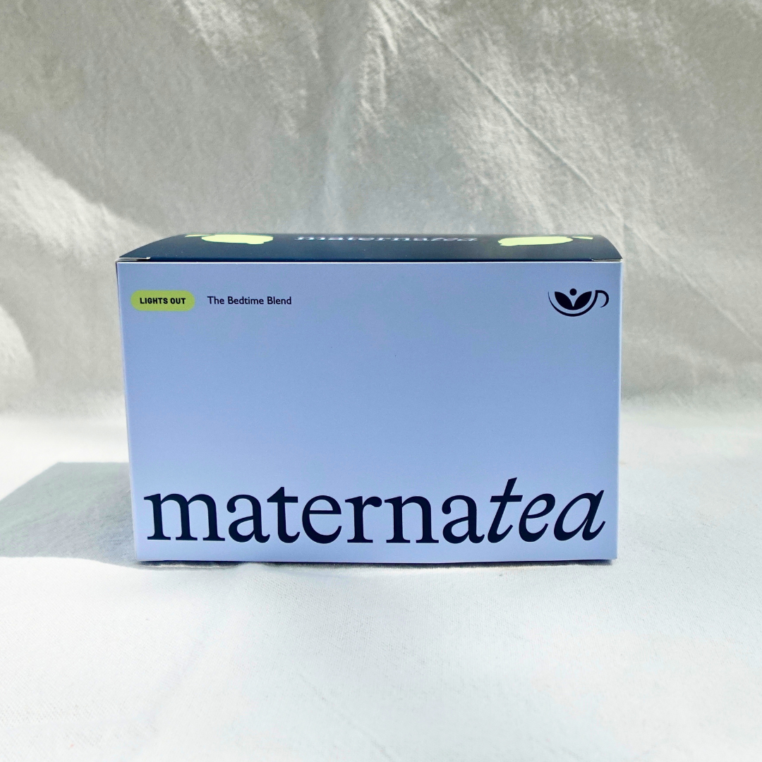 Box of maternatea tea on a textured white background